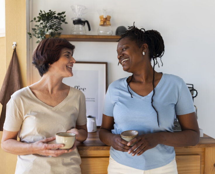 front-view-lesbian-couple-with-coffee-cups